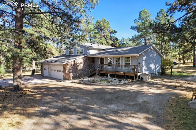 17265 Shahara Rd, Monument, CO 80132 - split level home featuring a porch and concrete driveway