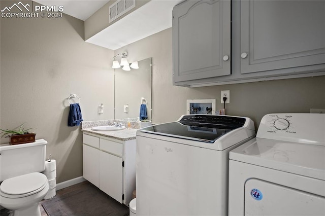 laundry area with sink and separate washer and dryer