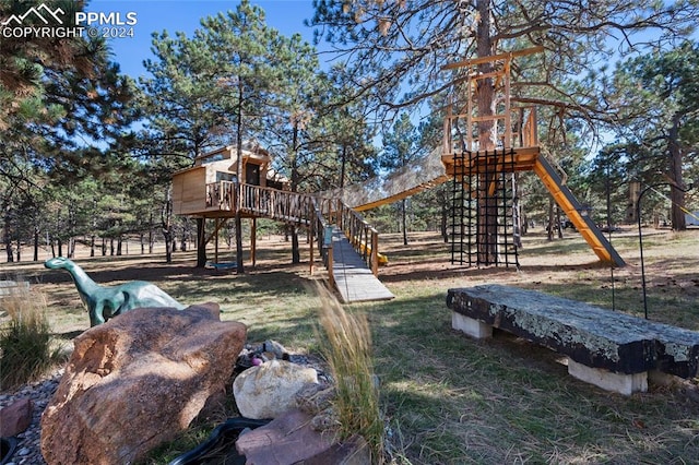 view of playground featuring a lawn