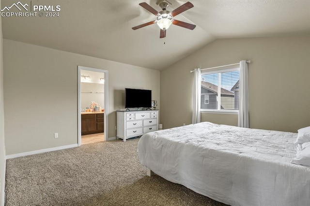 carpeted bedroom featuring ensuite bath, lofted ceiling, and ceiling fan