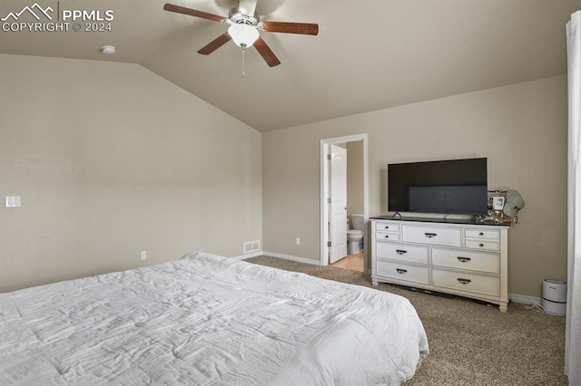 carpeted bedroom with connected bathroom, ceiling fan, and lofted ceiling