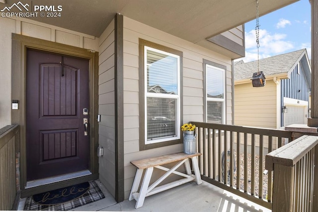 property entrance featuring a porch