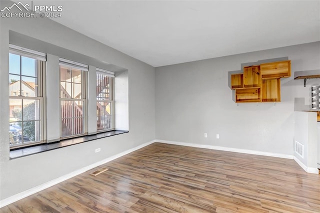 empty room featuring hardwood / wood-style flooring