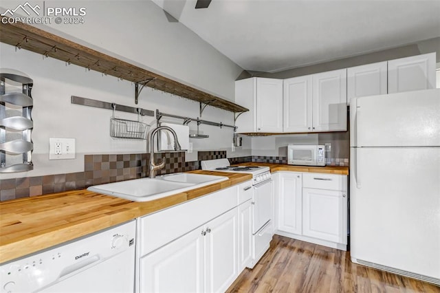 kitchen featuring white cabinetry, white appliances, and wood counters