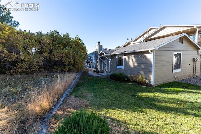 view of home's exterior featuring a lawn