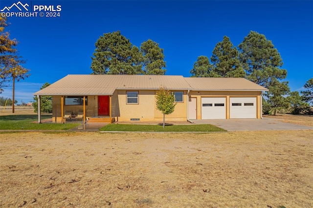 ranch-style home featuring a porch and a garage