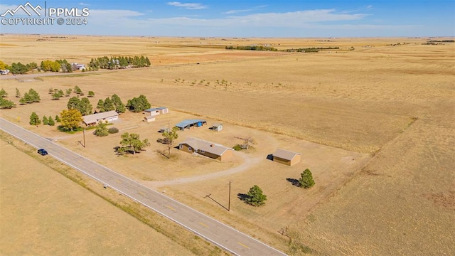 birds eye view of property featuring a rural view