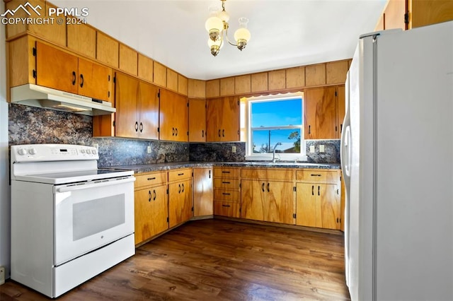 kitchen with dark hardwood / wood-style floors, sink, backsplash, and white appliances