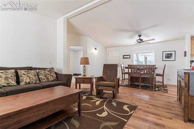 living room with wood-type flooring and ceiling fan