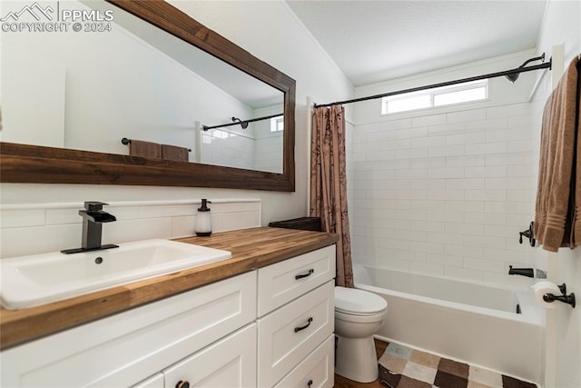 full bathroom featuring vanity, toilet, shower / bath combo with shower curtain, and backsplash