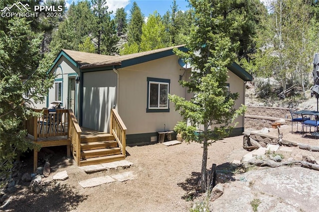 rear view of house with a deck