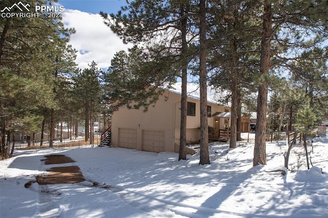 view of snow covered property