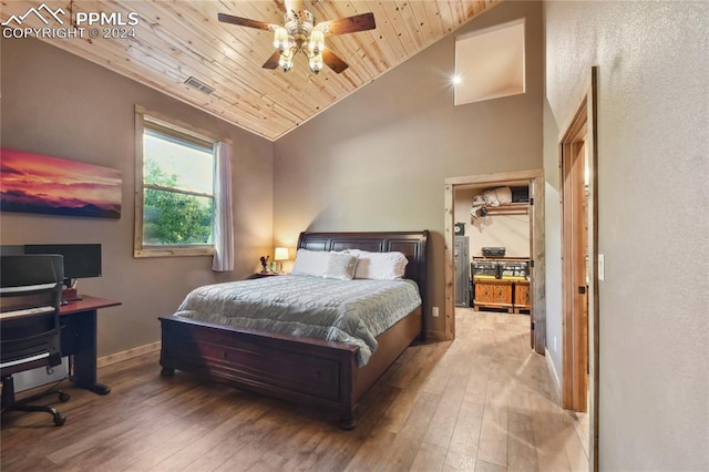 bedroom with wood ceiling, hardwood / wood-style flooring, ceiling fan, and vaulted ceiling