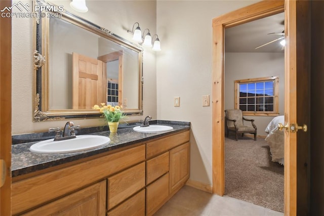 bathroom featuring vanity, tile patterned flooring, and ceiling fan