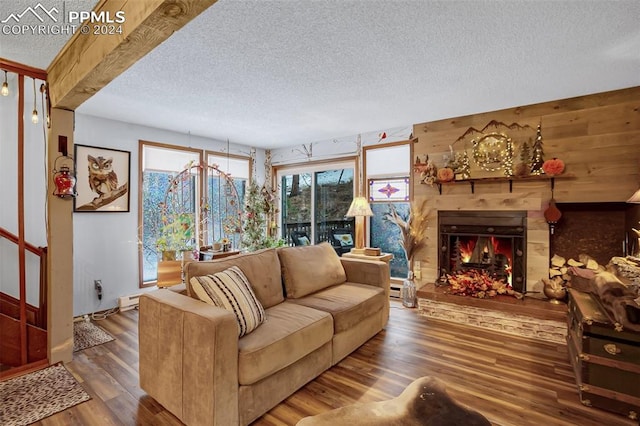 living room with a textured ceiling and hardwood / wood-style flooring