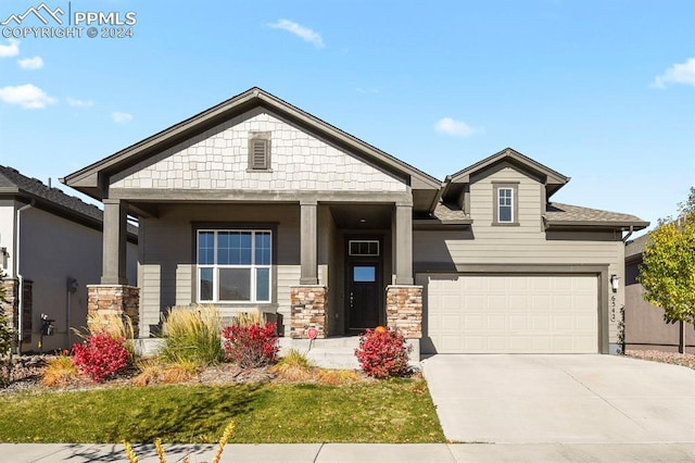 craftsman inspired home with a garage