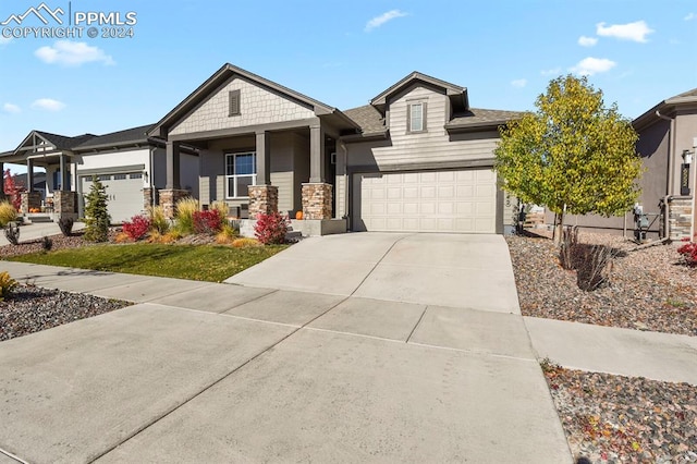 view of front of home with a garage and a porch