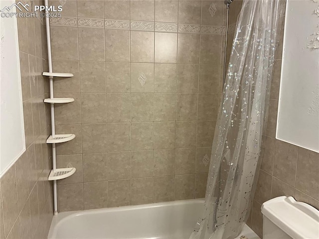 bathroom with shower / bath combination with curtain, toilet, and tile walls