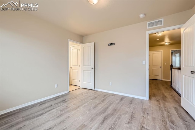 unfurnished bedroom featuring light hardwood / wood-style flooring