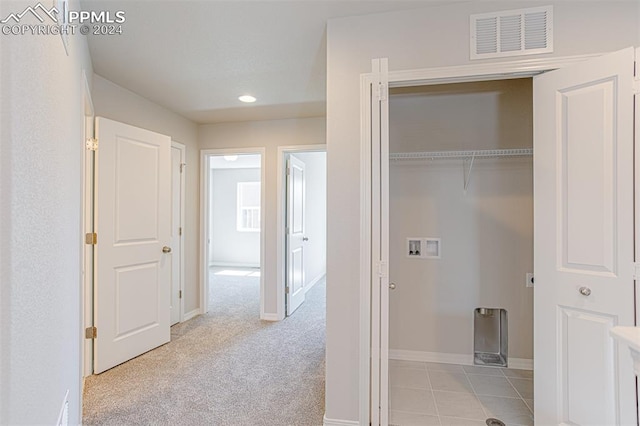 washroom with light carpet and washer hookup