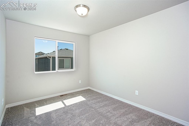 empty room featuring carpet floors