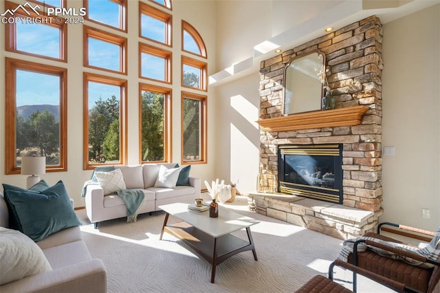 sunroom / solarium featuring a fireplace