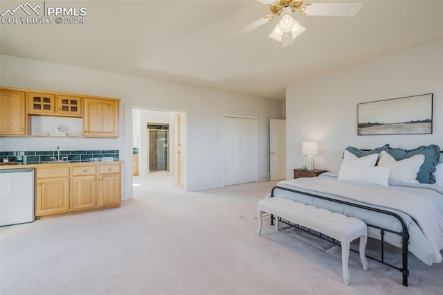 carpeted bedroom with a closet and ceiling fan