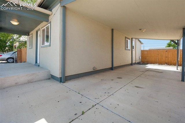 view of side of property with a patio