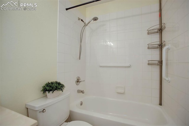 bathroom featuring toilet and tiled shower / bath combo