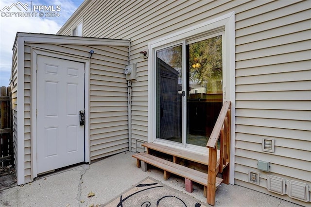 property entrance featuring a patio