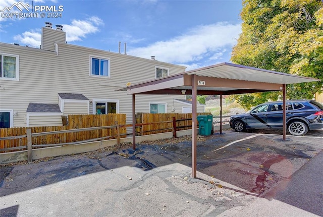 view of parking with a carport