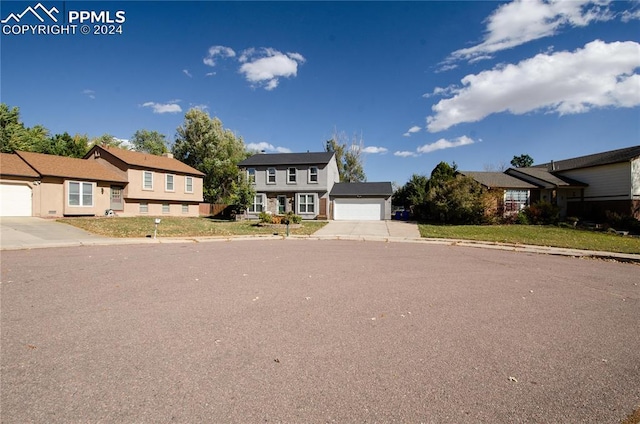 view of front of house with a front lawn and a garage