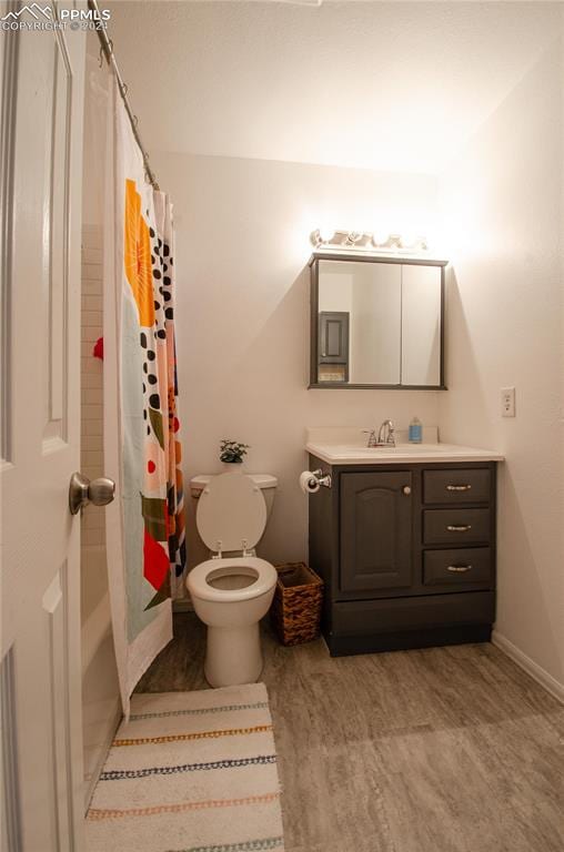 bathroom with vanity, a shower with curtain, and toilet