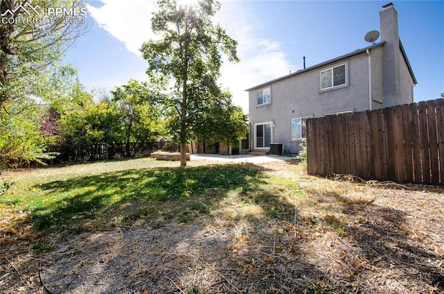 view of yard with a patio area and central AC unit