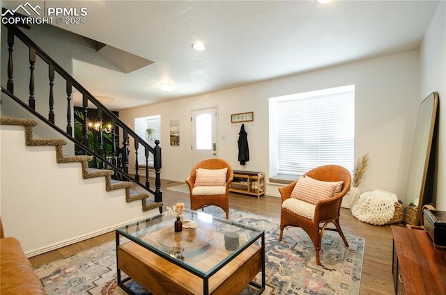 sitting room with hardwood / wood-style flooring