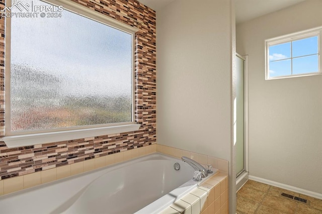 bathroom featuring tile patterned floors and plus walk in shower