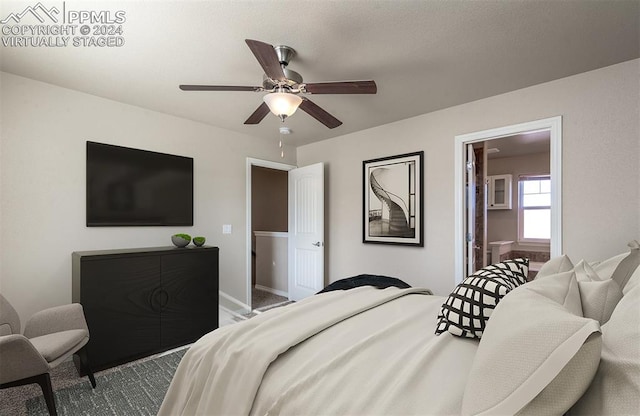 bedroom with ensuite bathroom and ceiling fan