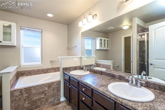 full bathroom featuring plenty of natural light, vanity, toilet, and plus walk in shower