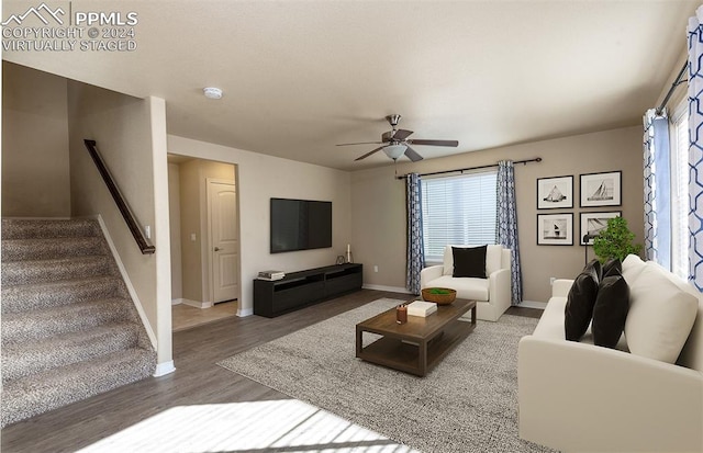 living room with hardwood / wood-style floors and ceiling fan