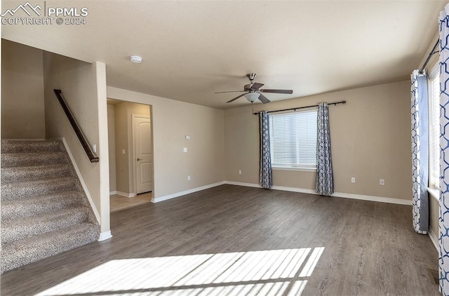 interior space with ceiling fan and dark hardwood / wood-style floors