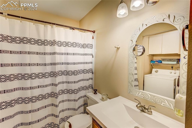 bathroom with vanity, toilet, washer / clothes dryer, and a shower with curtain