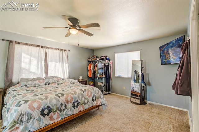 carpeted bedroom featuring ceiling fan