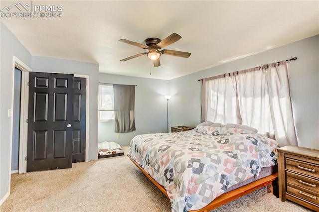 bedroom with ceiling fan and carpet floors