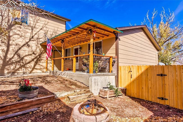 exterior space featuring a patio and a fire pit