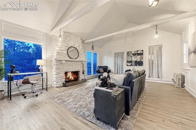 living room featuring a fireplace, wood-type flooring, and lofted ceiling with beams