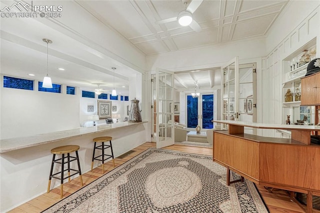 interior space featuring ceiling fan and french doors