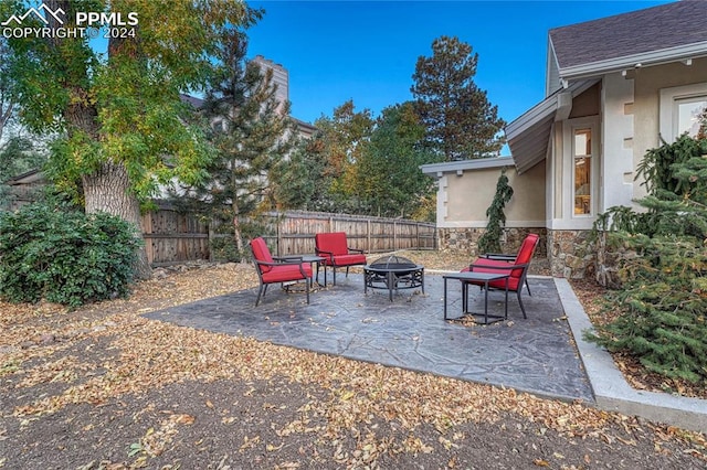 view of patio / terrace featuring a fire pit