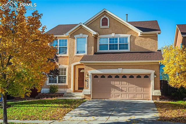 view of front of home with a garage