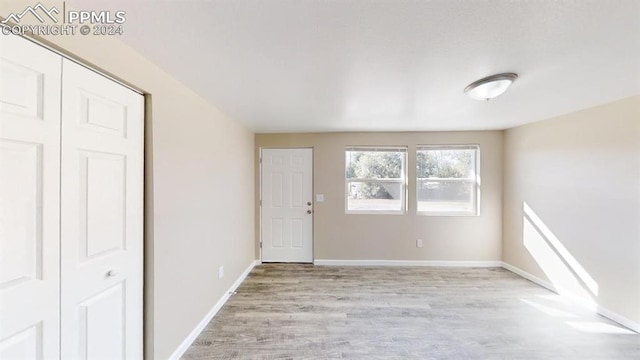 spare room featuring light hardwood / wood-style flooring