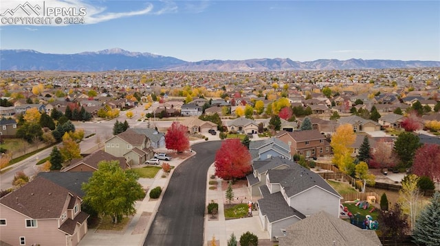 drone / aerial view featuring a mountain view